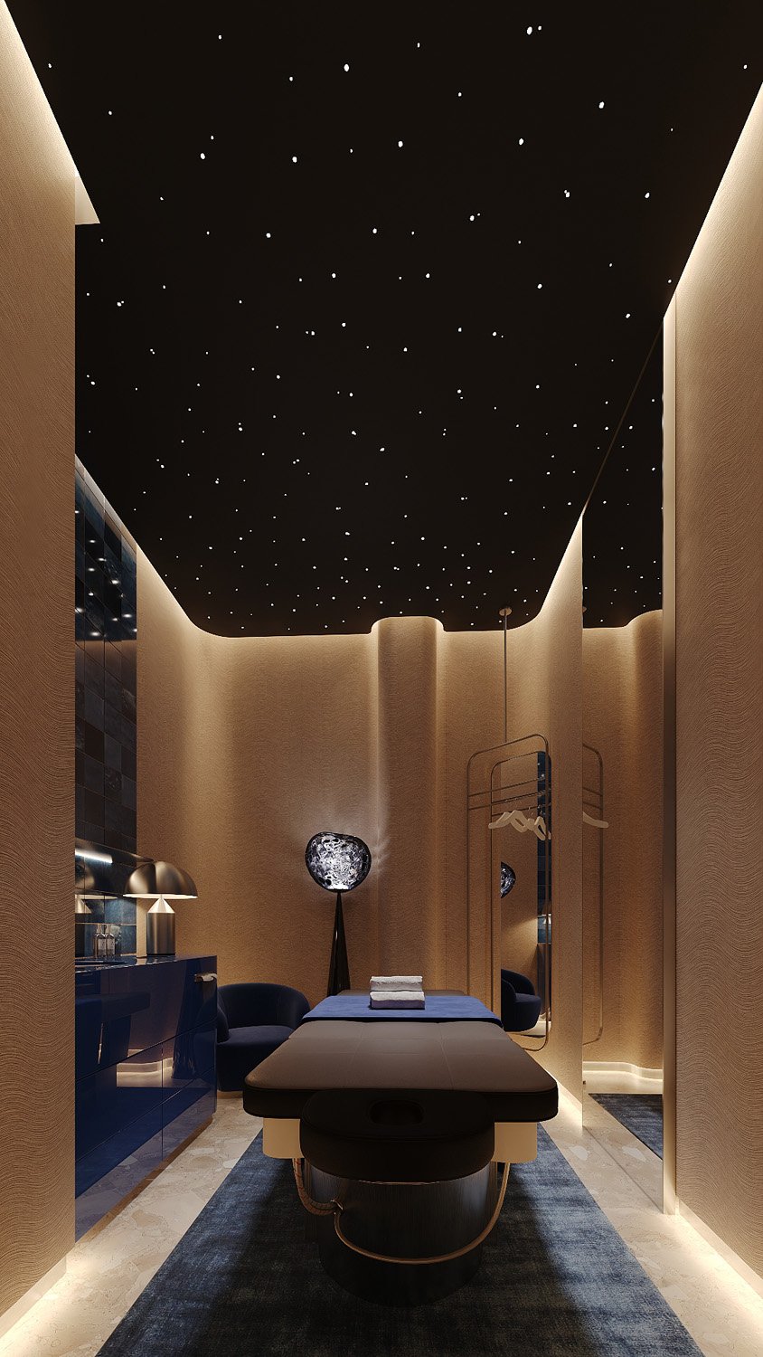 Massage room designed by Limestone for FŌM Hygge Spa, City Walk Dubai, with rounded textured walls, a starlit ceiling, blue lacquer cabinetry and sculptural lighting
