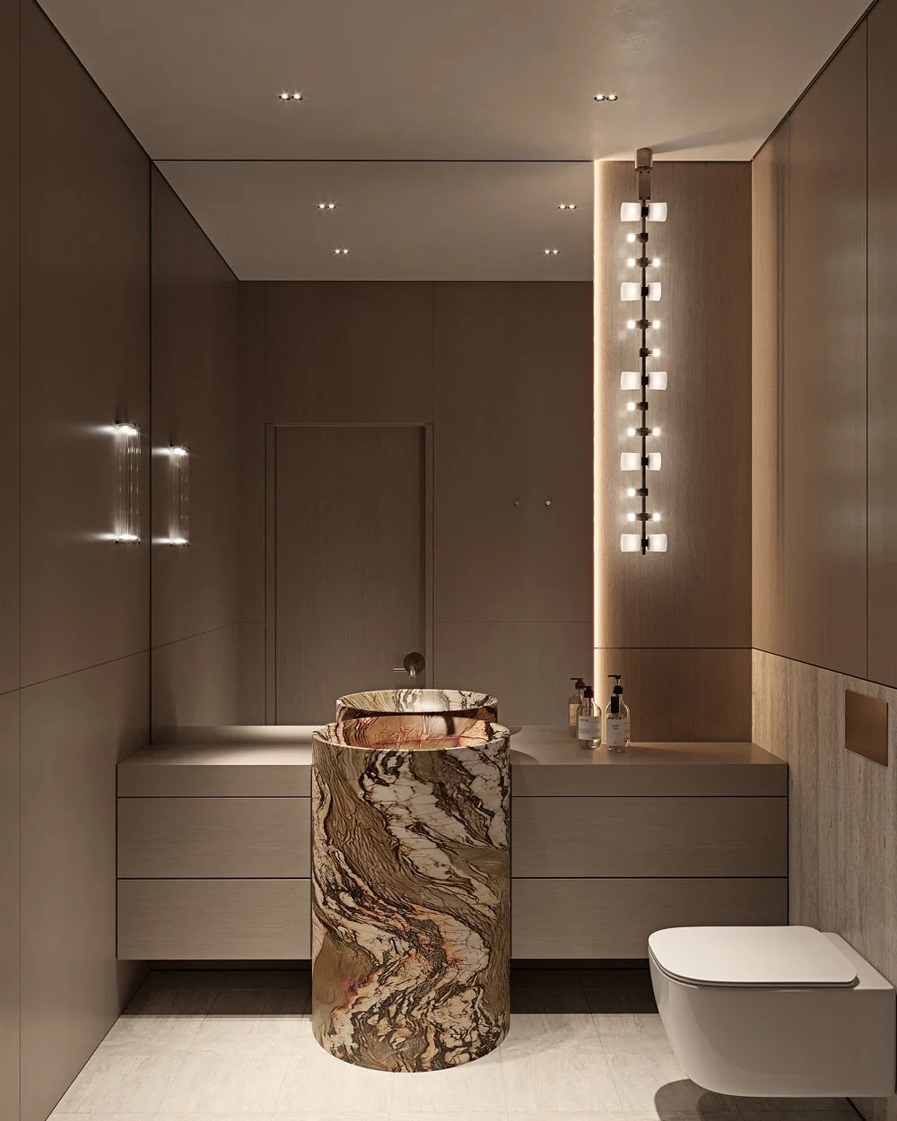 Powder room in Villa Viola, Dubai Hills, featuring a sculptural veined marble pedestal basin, dark oak wall panelling, and a vertical strip of glass pendant lights by Limestone