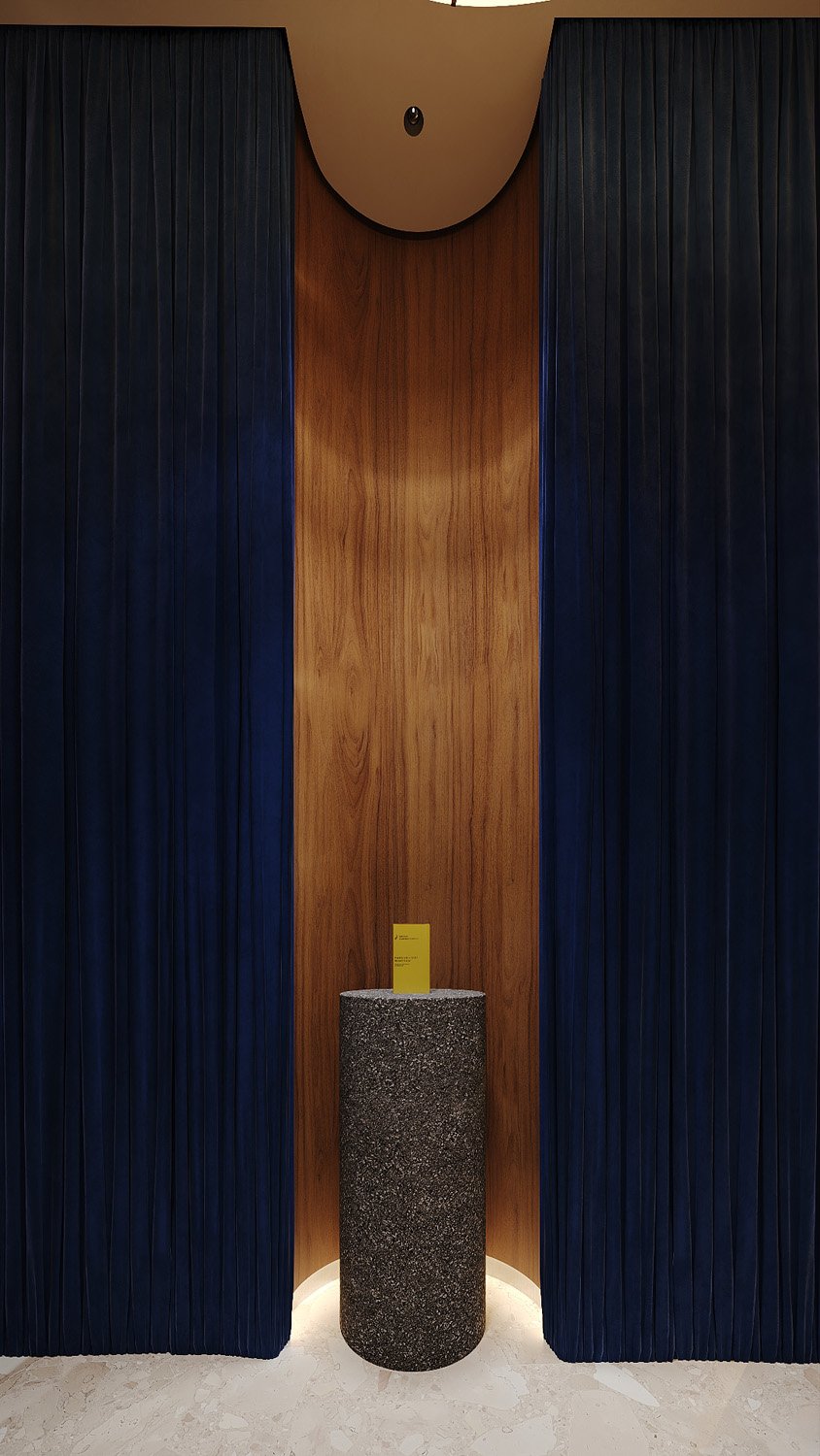 Wellness space design by Limestone at FŌM Hygge Spa, City Walk Dubai, with a resin crushed stone plinth set in a curved lacquered wood niche framed by electric blue velvet