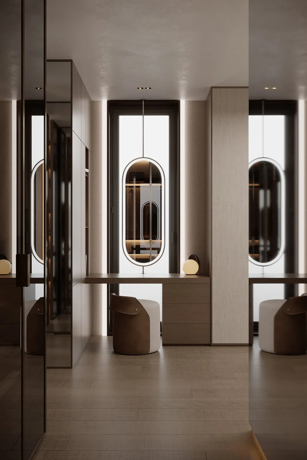 Master walk-in wardrobe vanity nook in Villa Viola, Dubai Hills, with an oval pendant mirror, wood dressing table, and mirrored wardrobe doors by Limestone