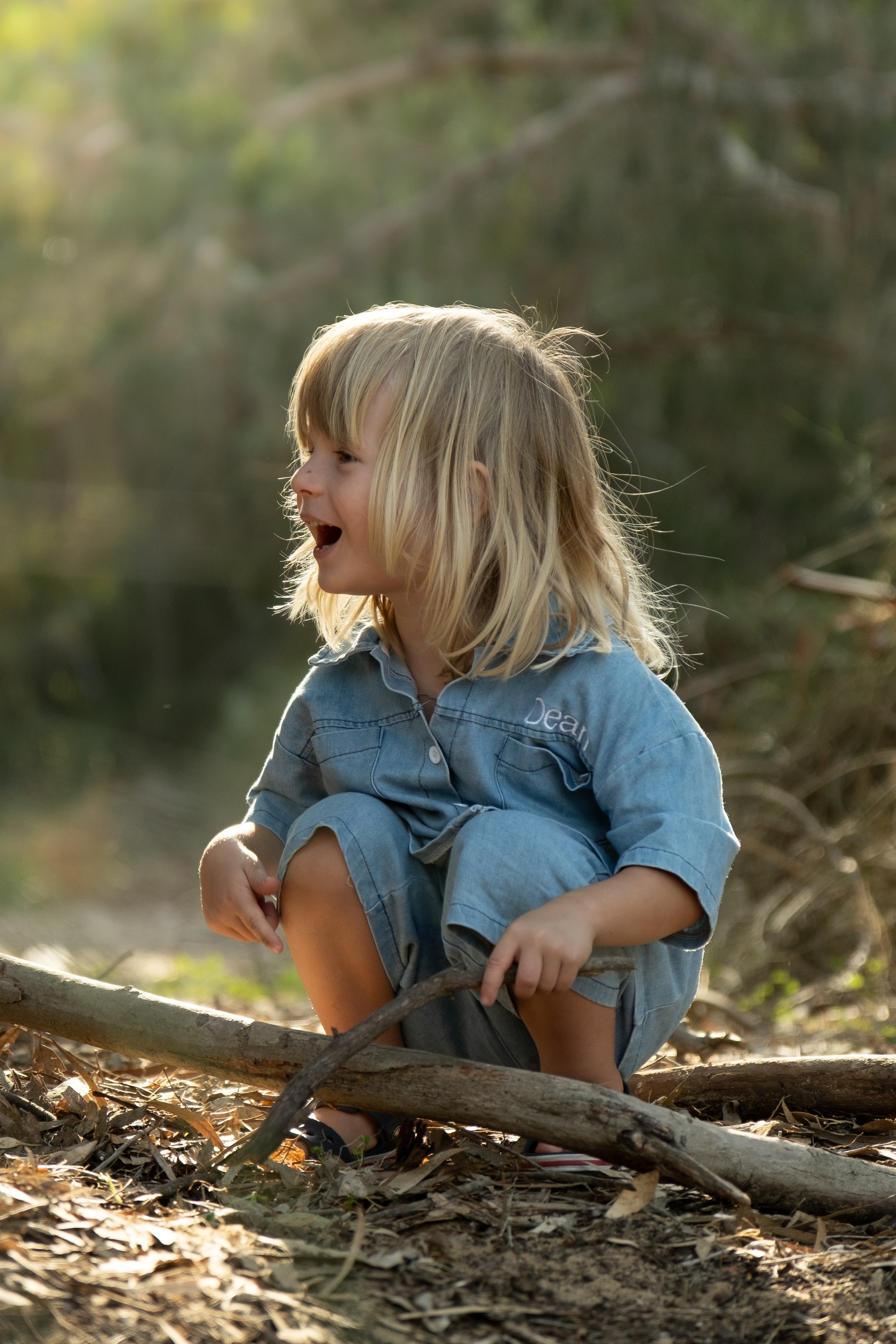 Kid playing in the woods