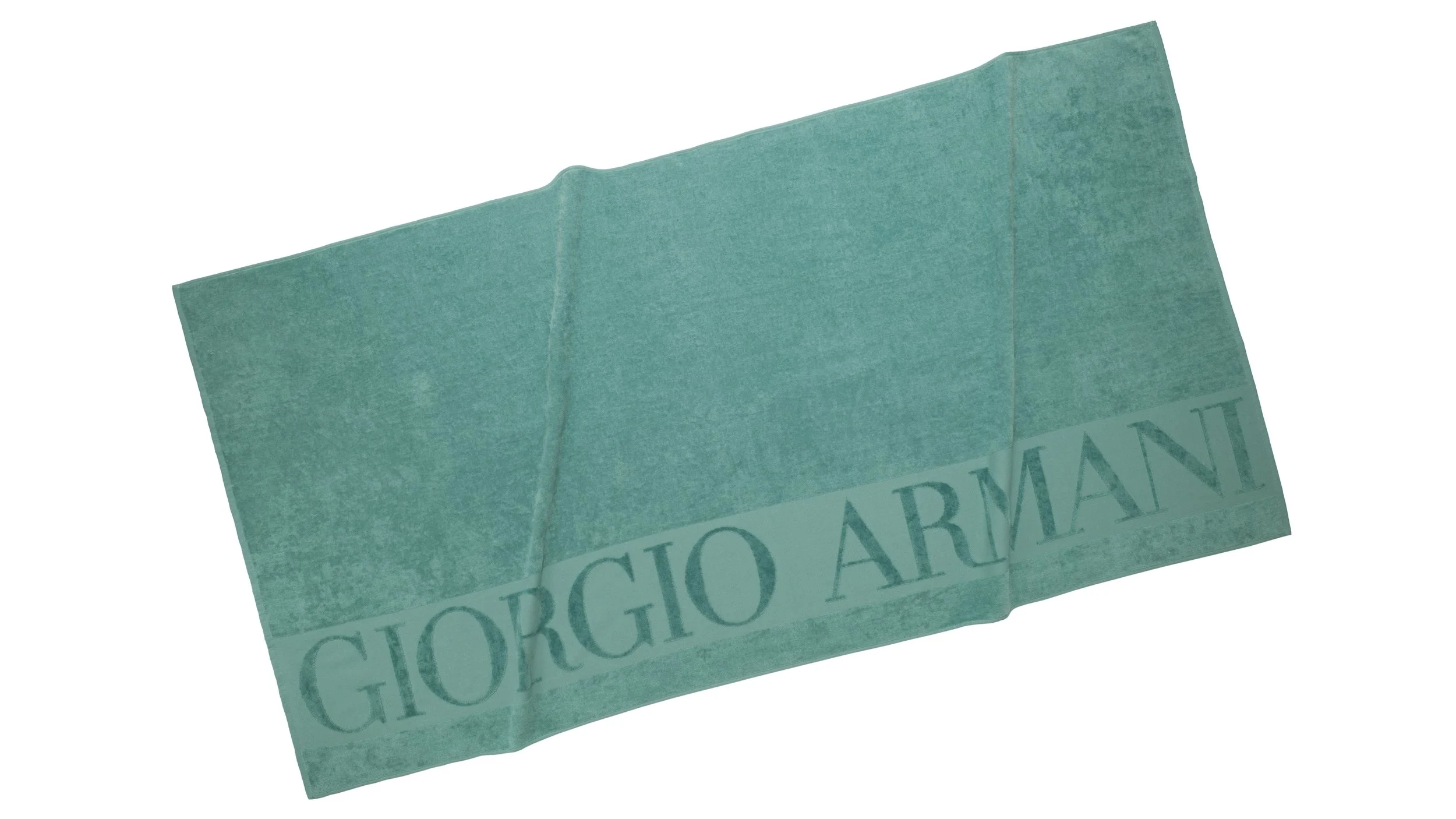 Barre de chocolat vert avec le mot 'Giorgio Armani' écrit dessus.