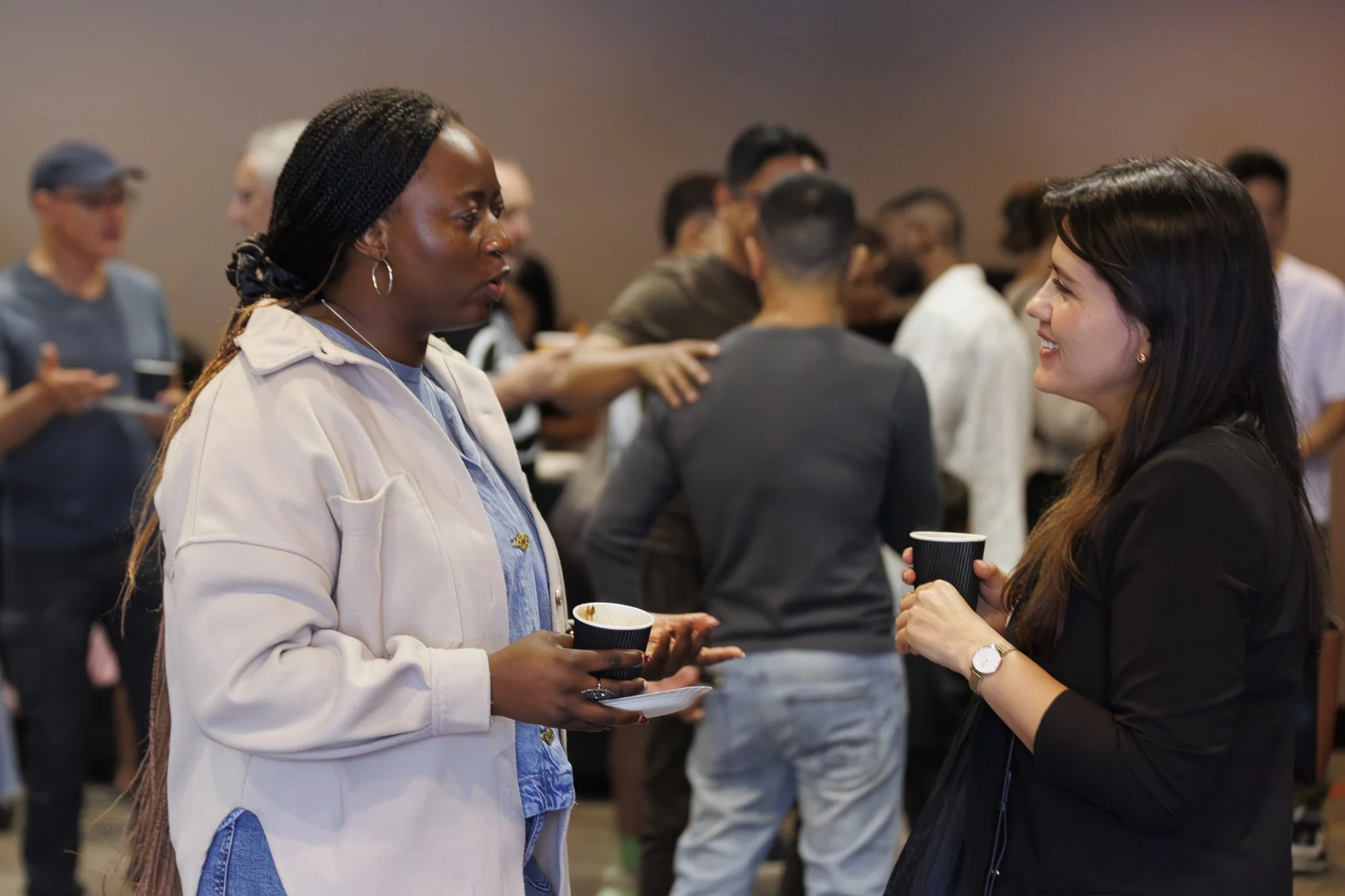 Two women having a conversation at Worship service at Citizens Church Sydney
