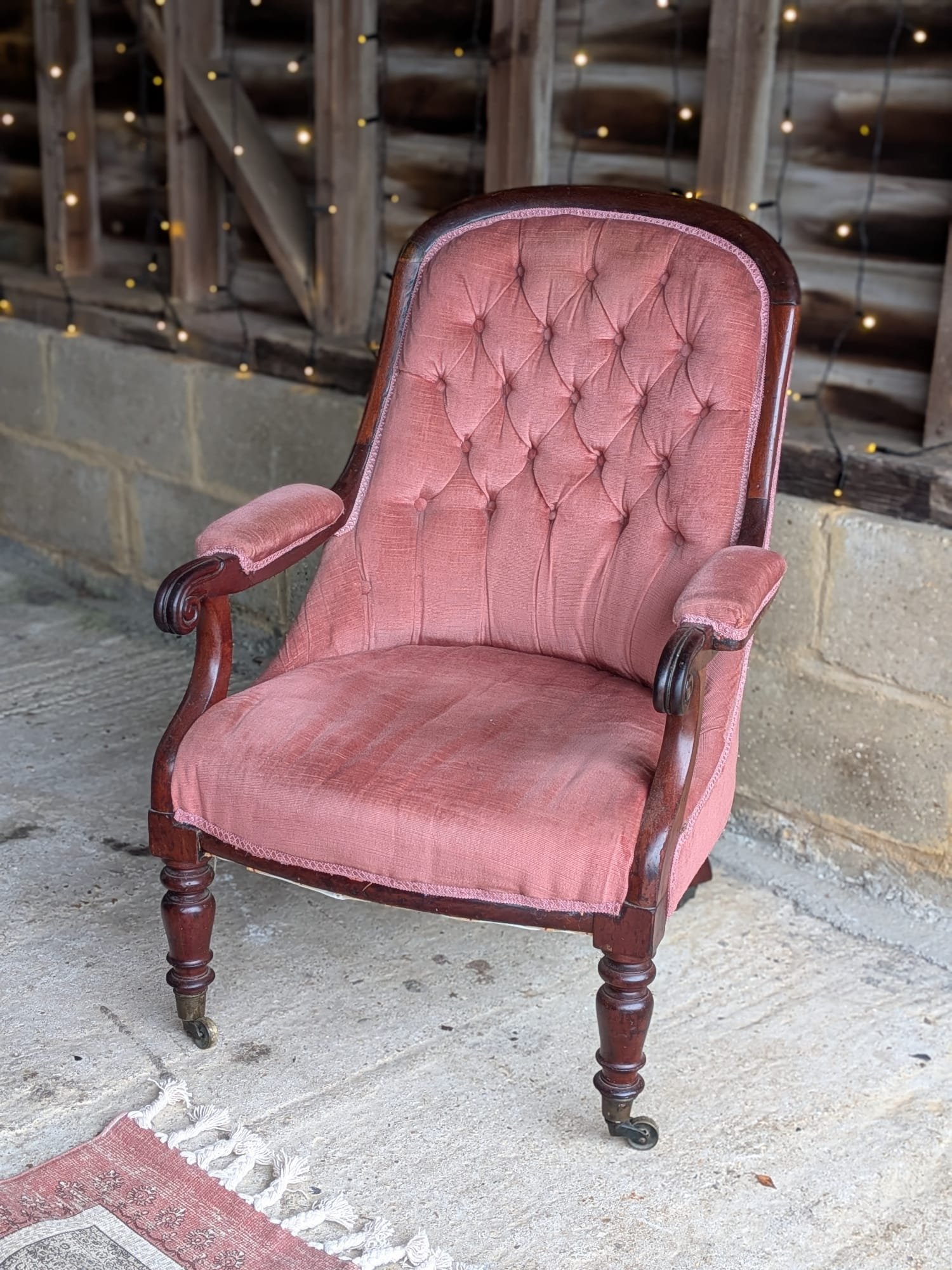 Pink armchair with wooden arms and legs | £30.00