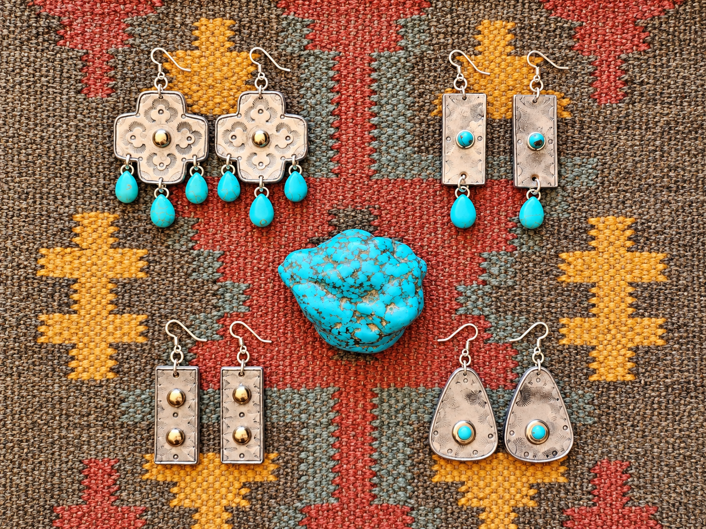 Chrome leather earrings around turquoise rock.png