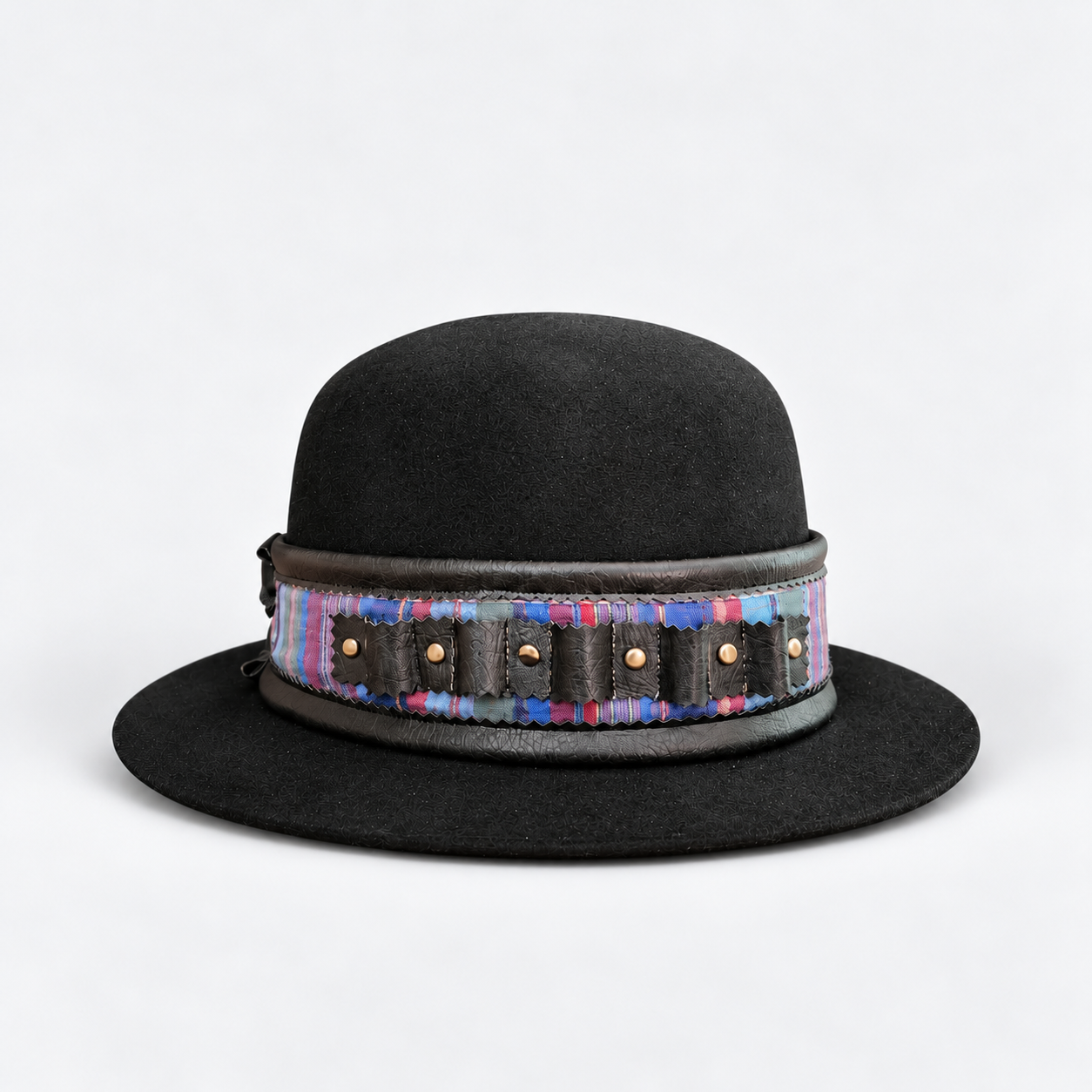 Black bowler hat on gray studio backdrop-3.png