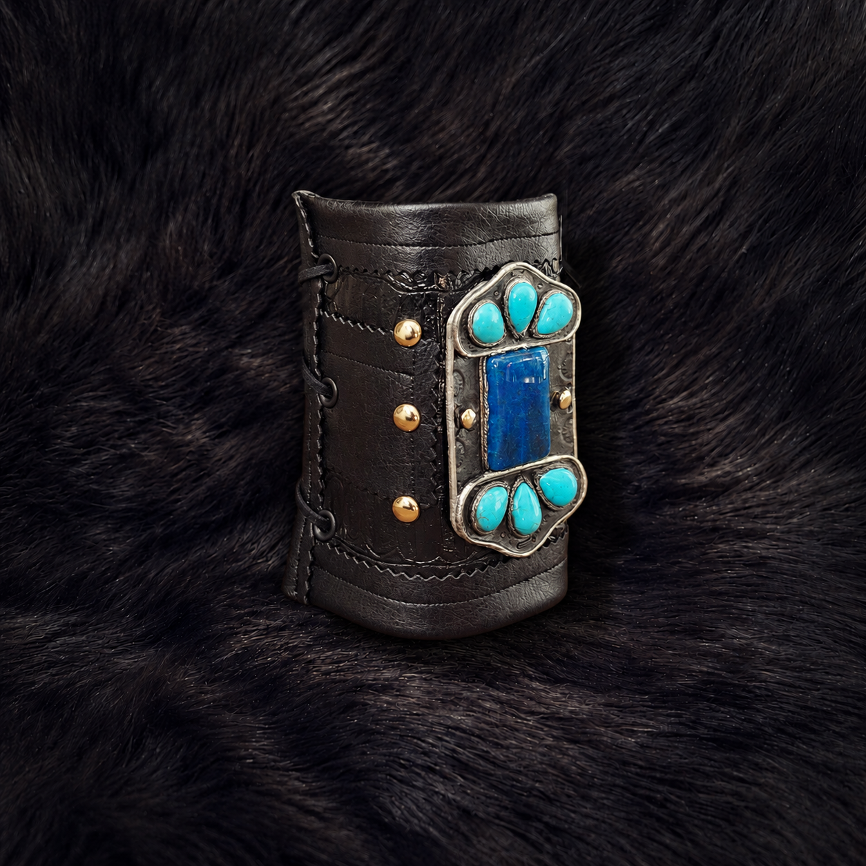 Turquoise-studded leather cuff on dark fur-3.png