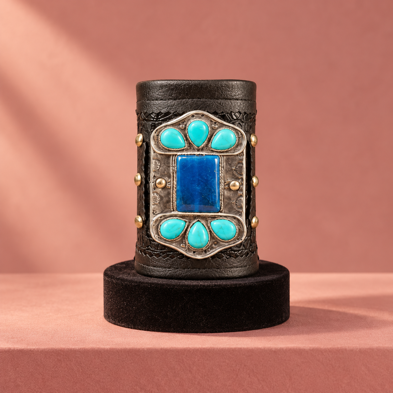 Retro turquoise cuff on blush velvet.png