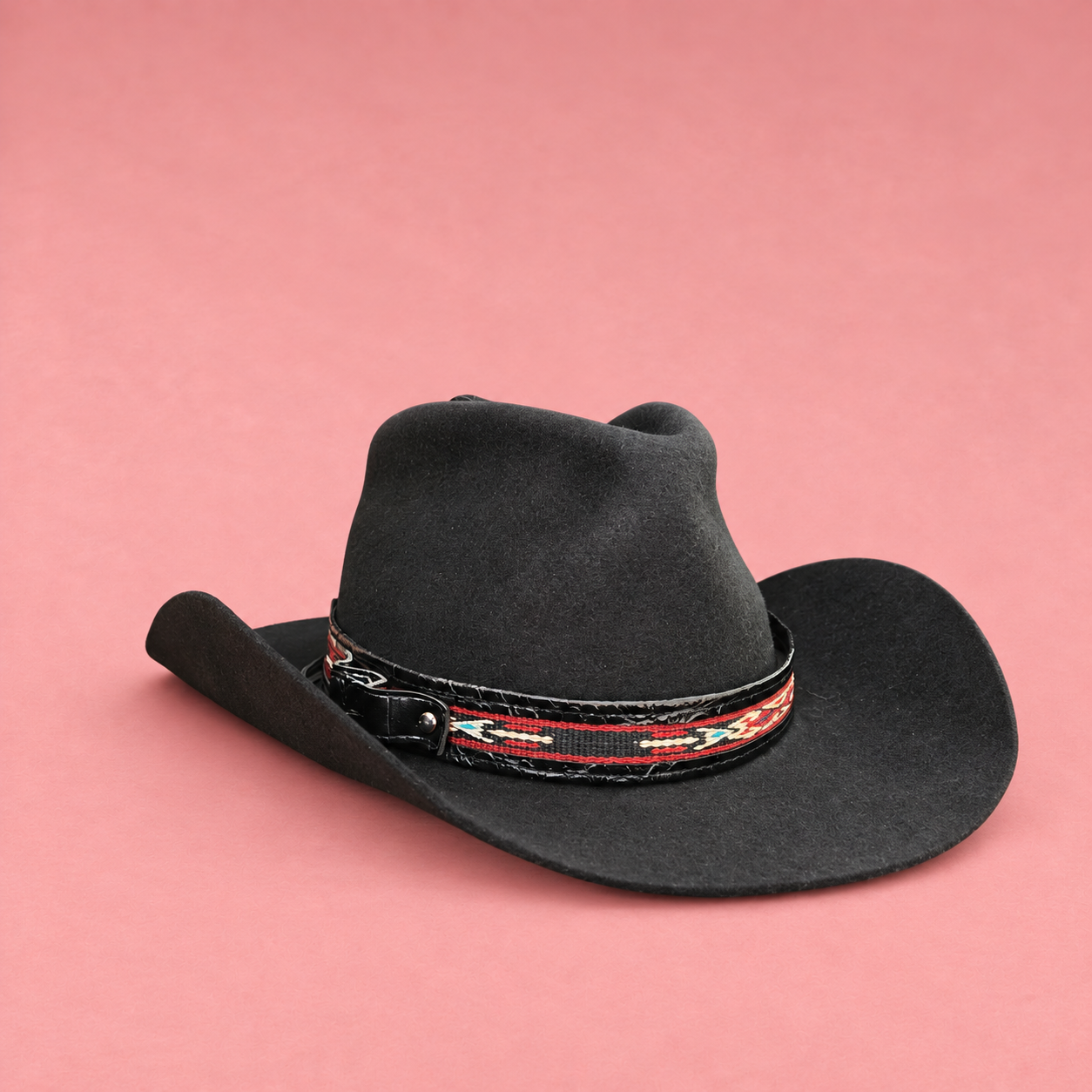 Black cowboy hat on blush pink (1).png