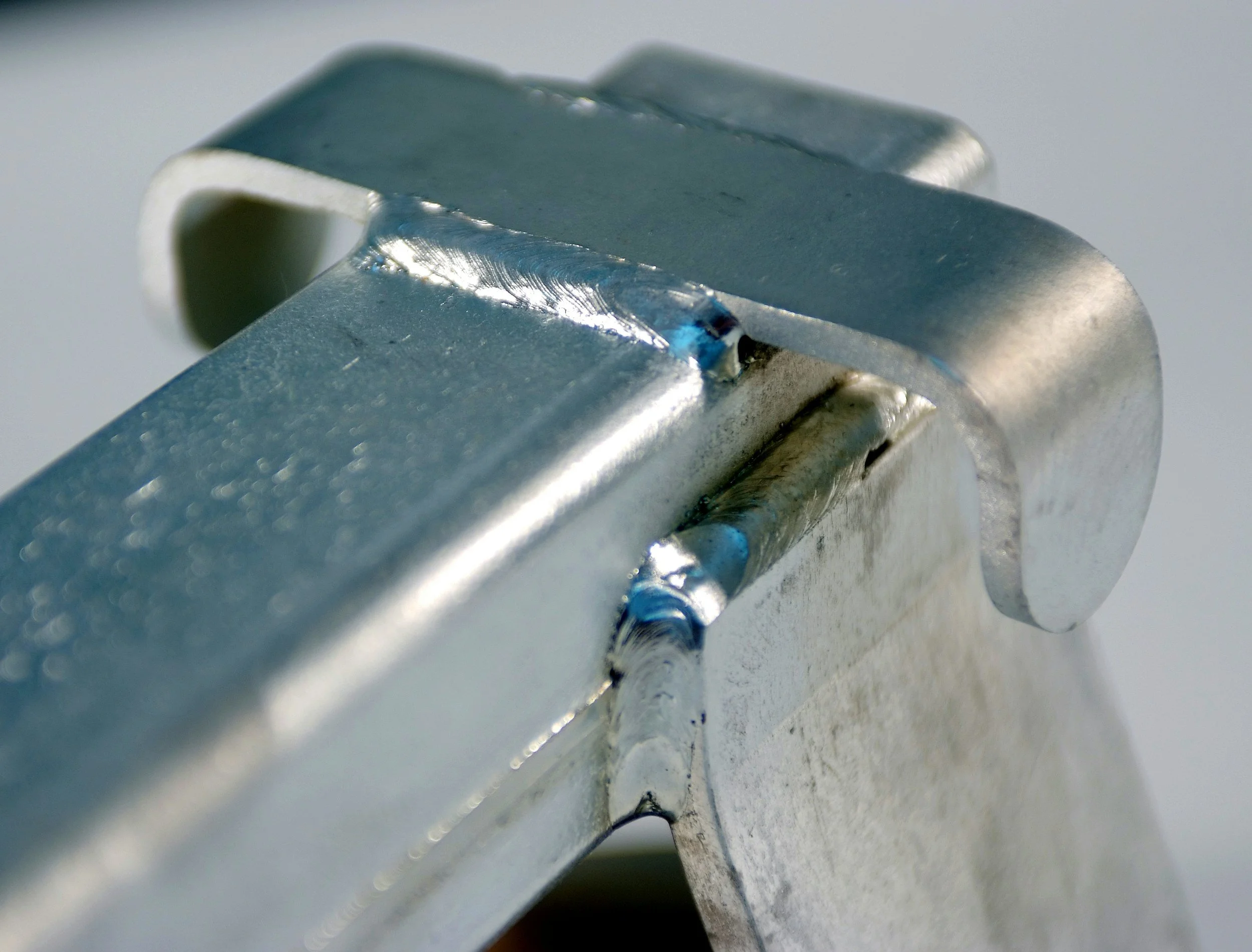 Close-up of a metallic hinge or mechanical part.