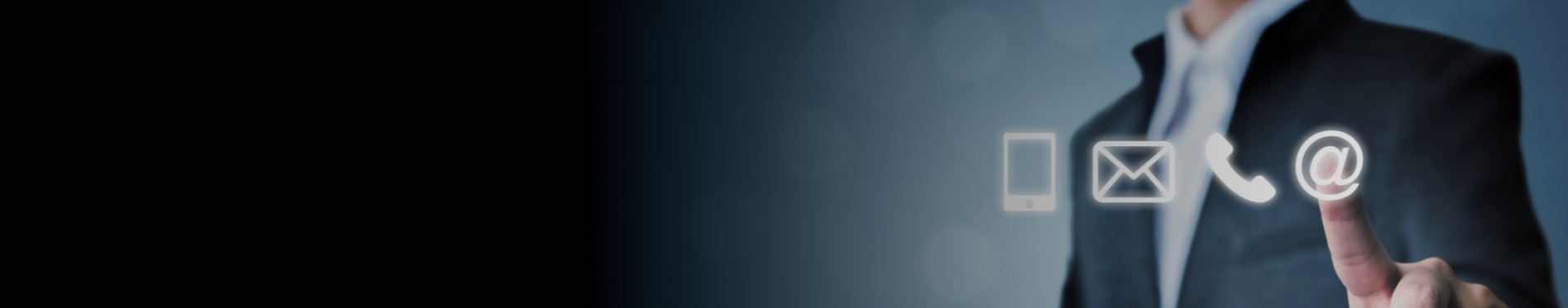 A person in a business suit pointing at floating icons of a smartphone, envelope, phone, and email at their fingertips, with a dark background and light overlay.