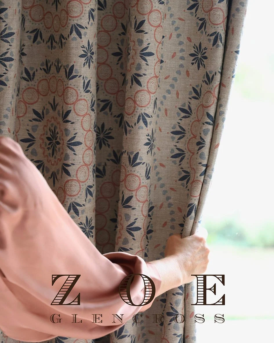Person pulling aside patterned curtain in a well-lit room, with the text 'ZOE GLENCROSS' at the bottom.