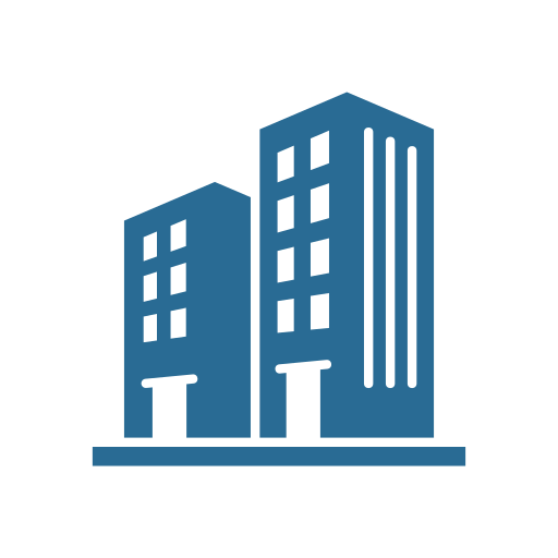 Icon of two blue buildings with multiple windows, representing a cityscape or urban area.