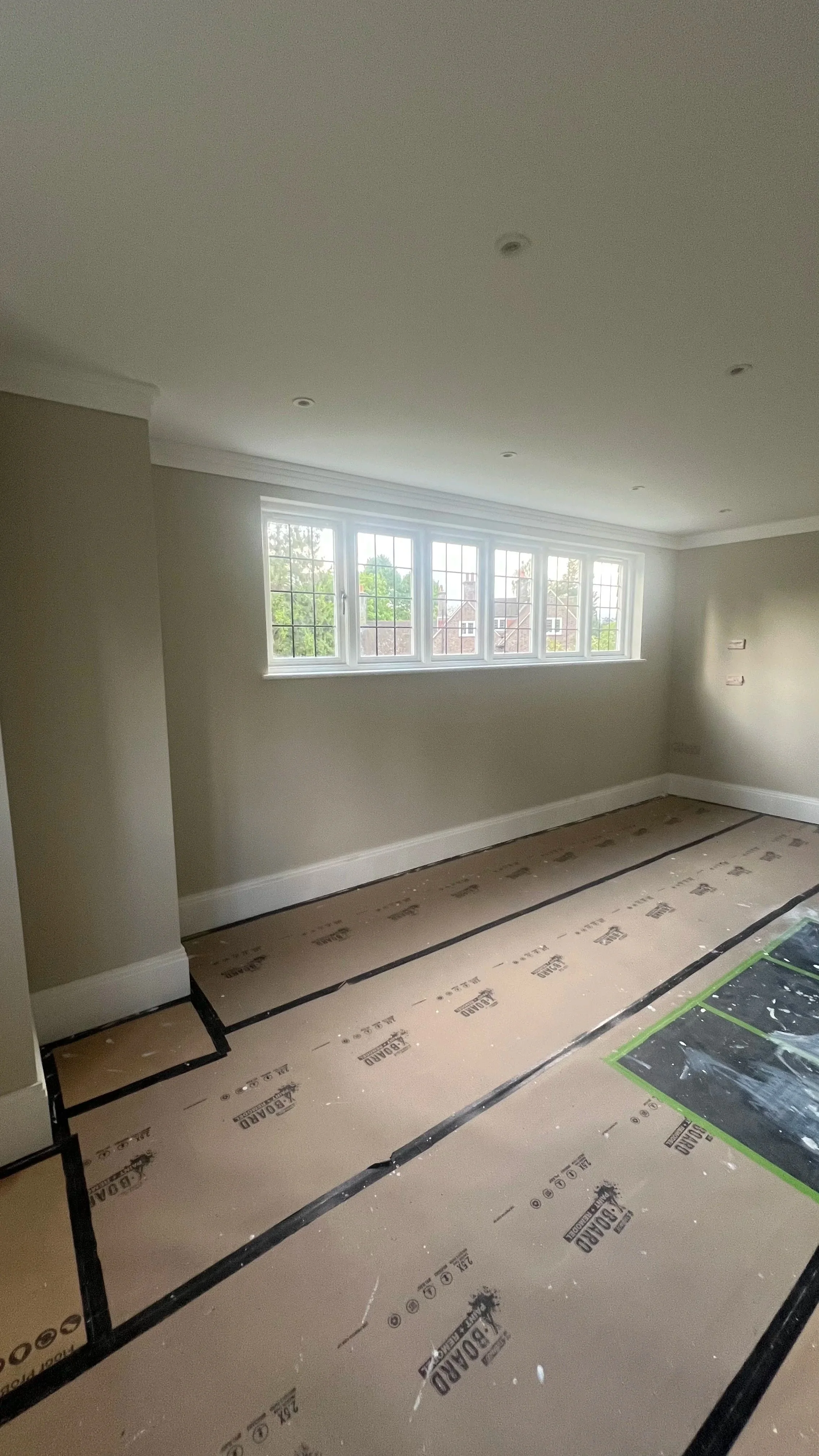 Bespoke wall panellingDeep-toned, traditional wall panelling finished with crisp moulded detailing and a substantial decorative cornice.