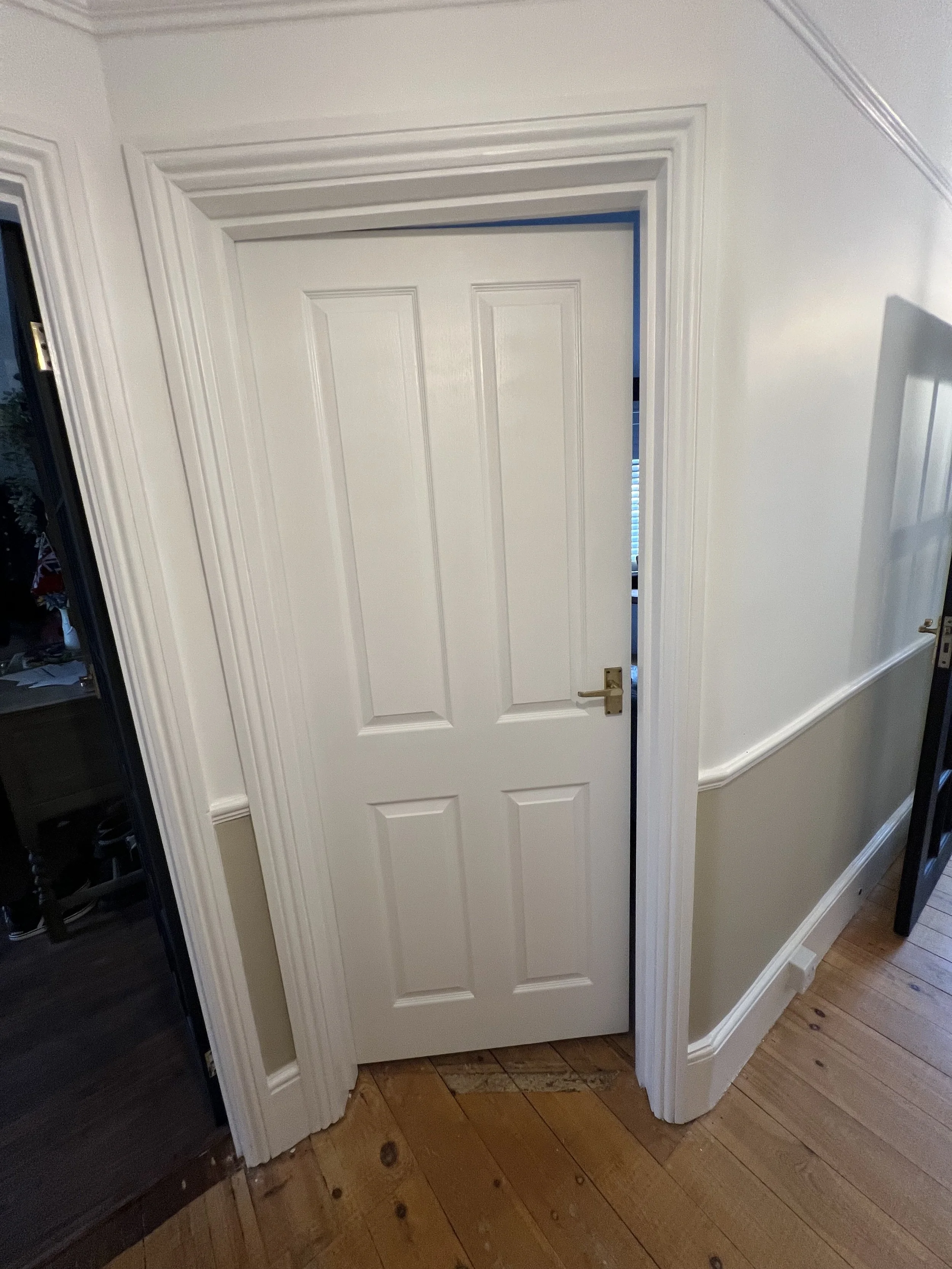 Crisp detailing and flawless paintwork on traditional timber features.