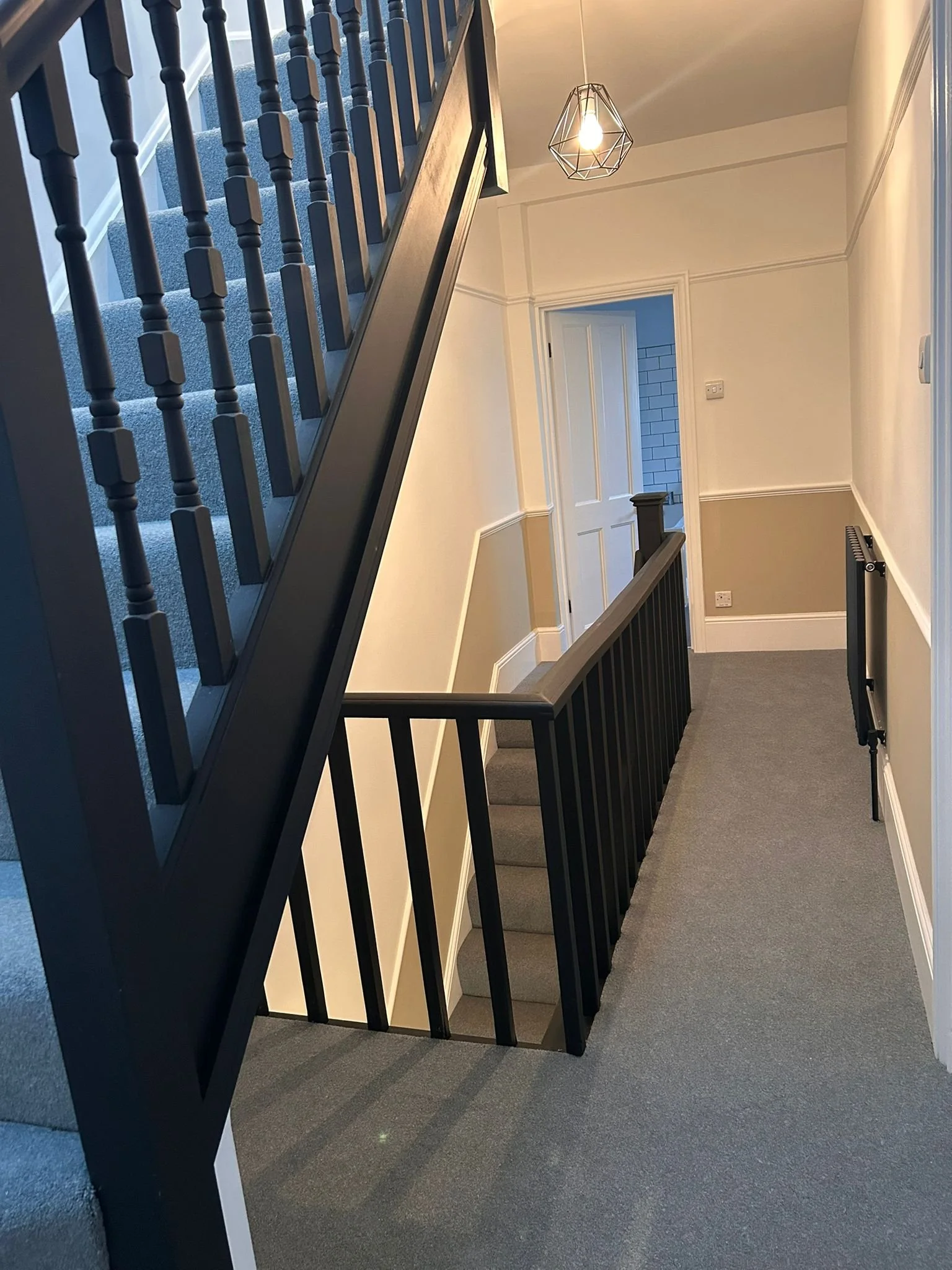 Sharp geometry and smooth transitions across stairwell panelling.