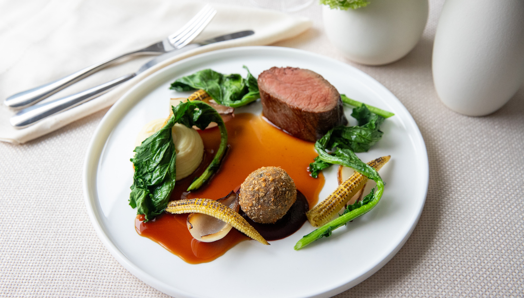 Rump of Hereford beef served with charred baby corn and a portion of creamy pommes purée.