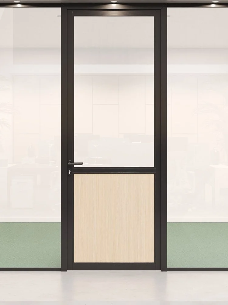 A glass office door with a black frame and a beige lower panel, leading to an office space with green carpeting.