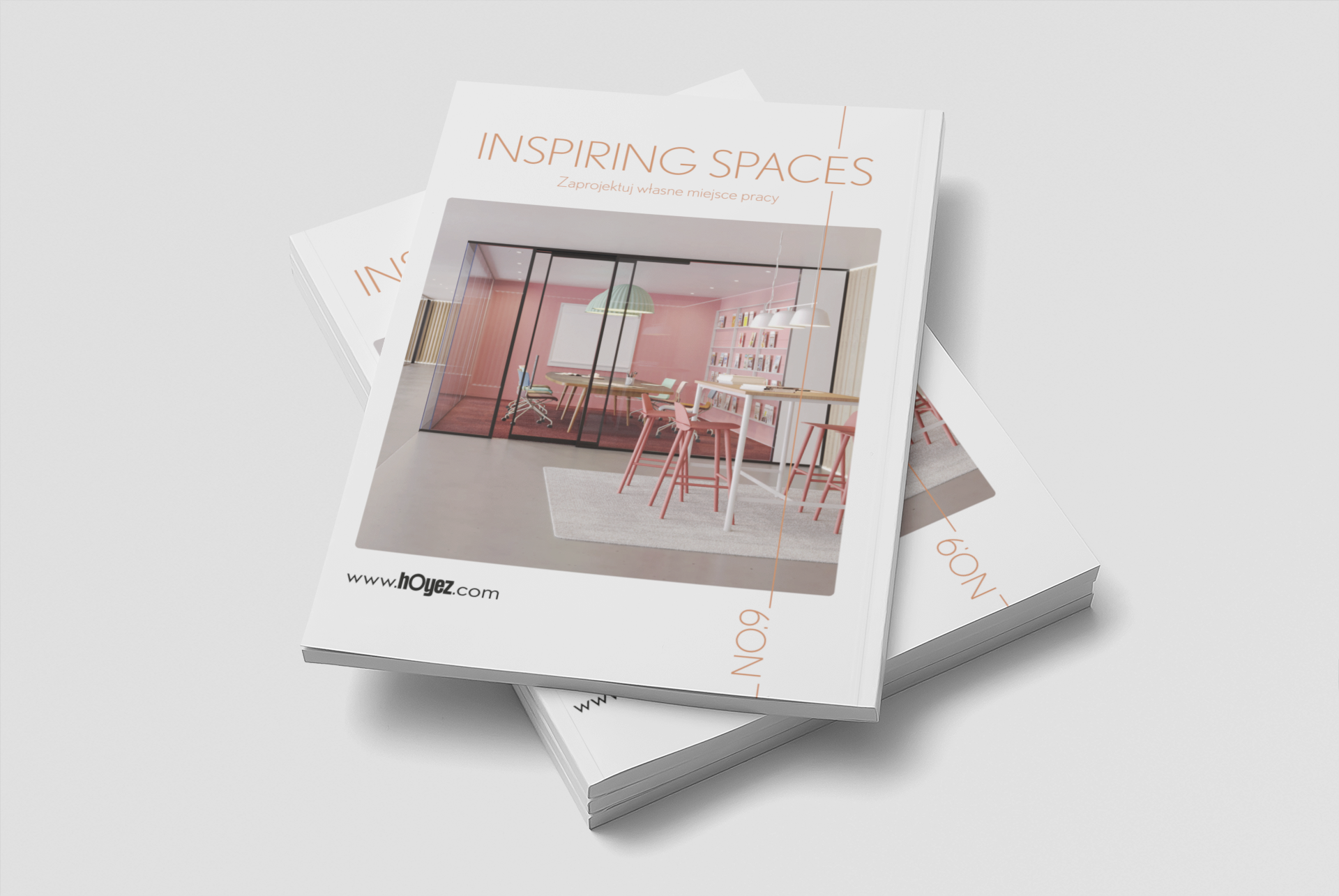 Two magazines titled "INSPIRING SPACES" with a photo of a modern, pink and white office interior featuring a glass-walled meeting room, pink chairs, a white table, and pink barstools in a minimalist design.