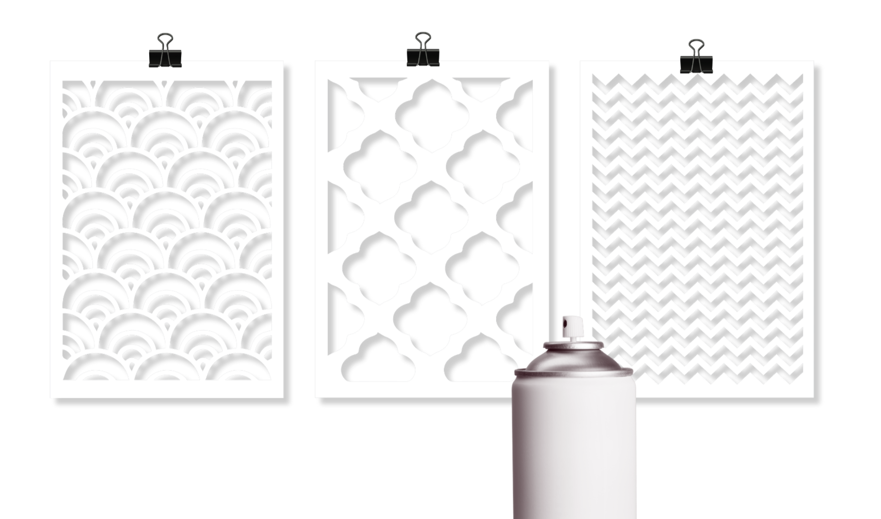Three craft stencil sheets with scallop, quatrefoil, and chevron patterns next to spray paint can.