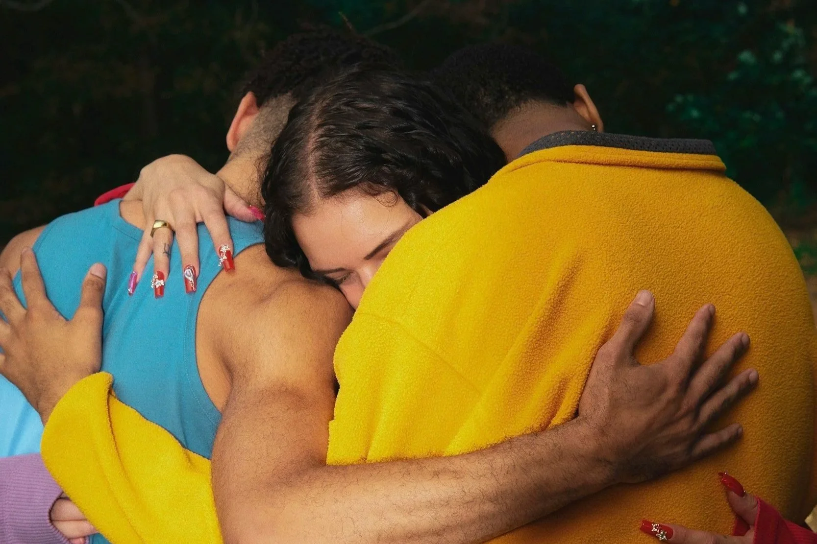 Surrogate with Intended Dads hugging