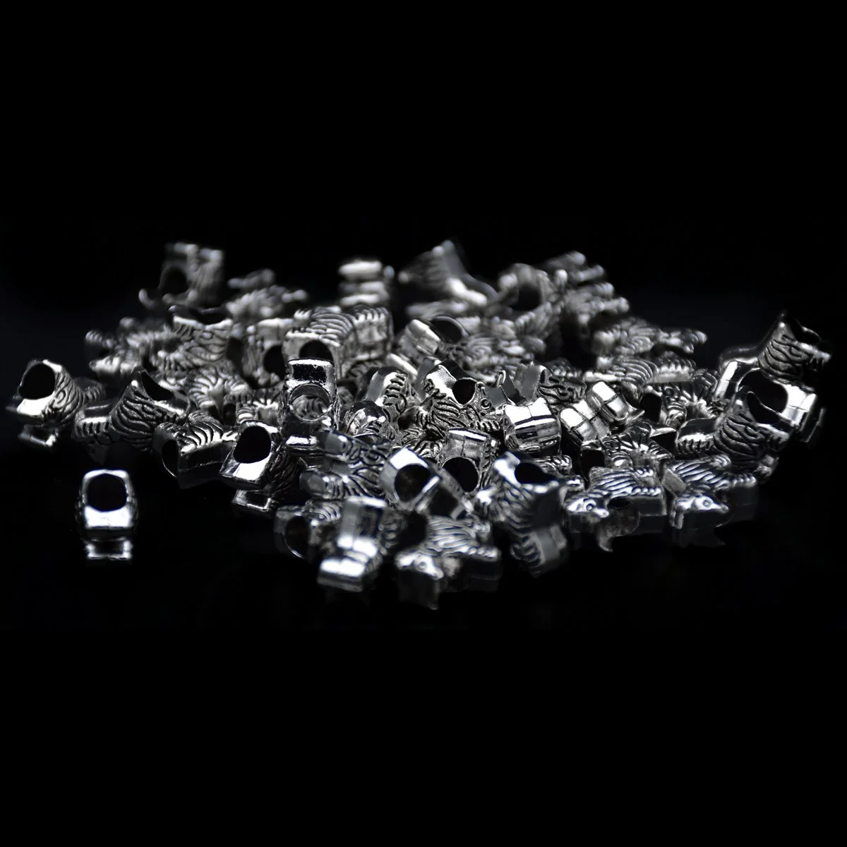 lots of big hole zebra shape and pattern pandora beads scattering around