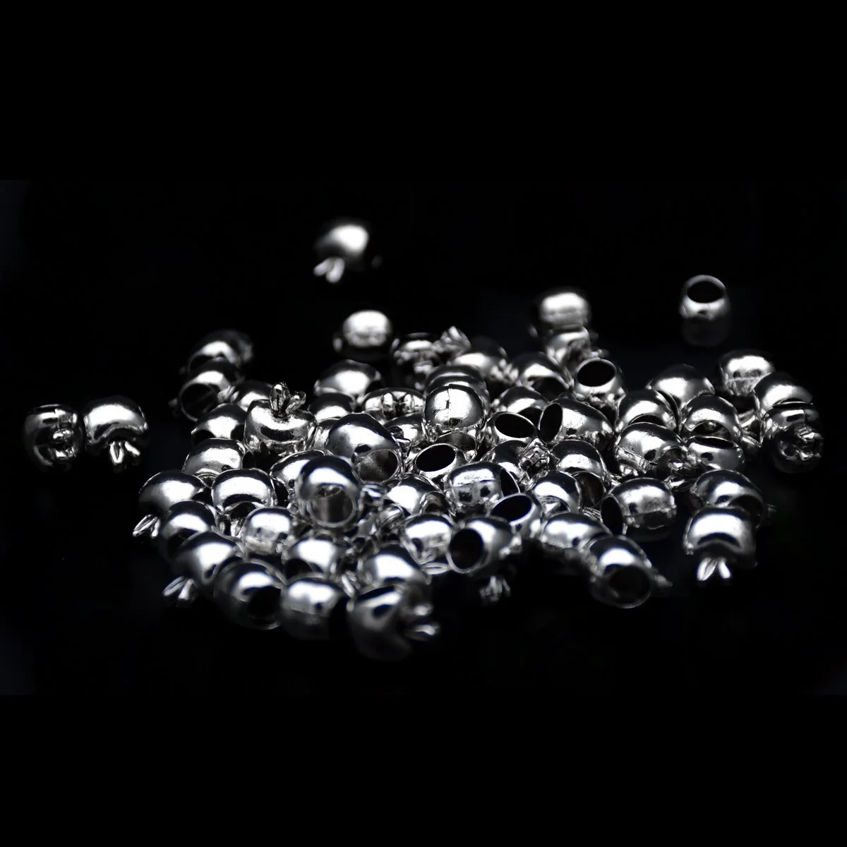 bulk of silver plated apple shape big hole pandora beads showcase in a black background