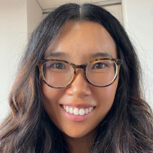 Woman with dark brown hair and glasses