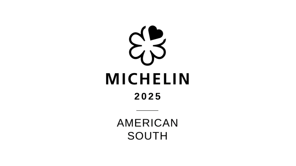A black and white logo featuring a stylized silhouette of a woman holding a bow and arrow, with the text "MICHELIN 124 AMERICAN SOUTH" beneath.