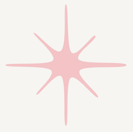 A pink star-shaped object on a light-colored background.