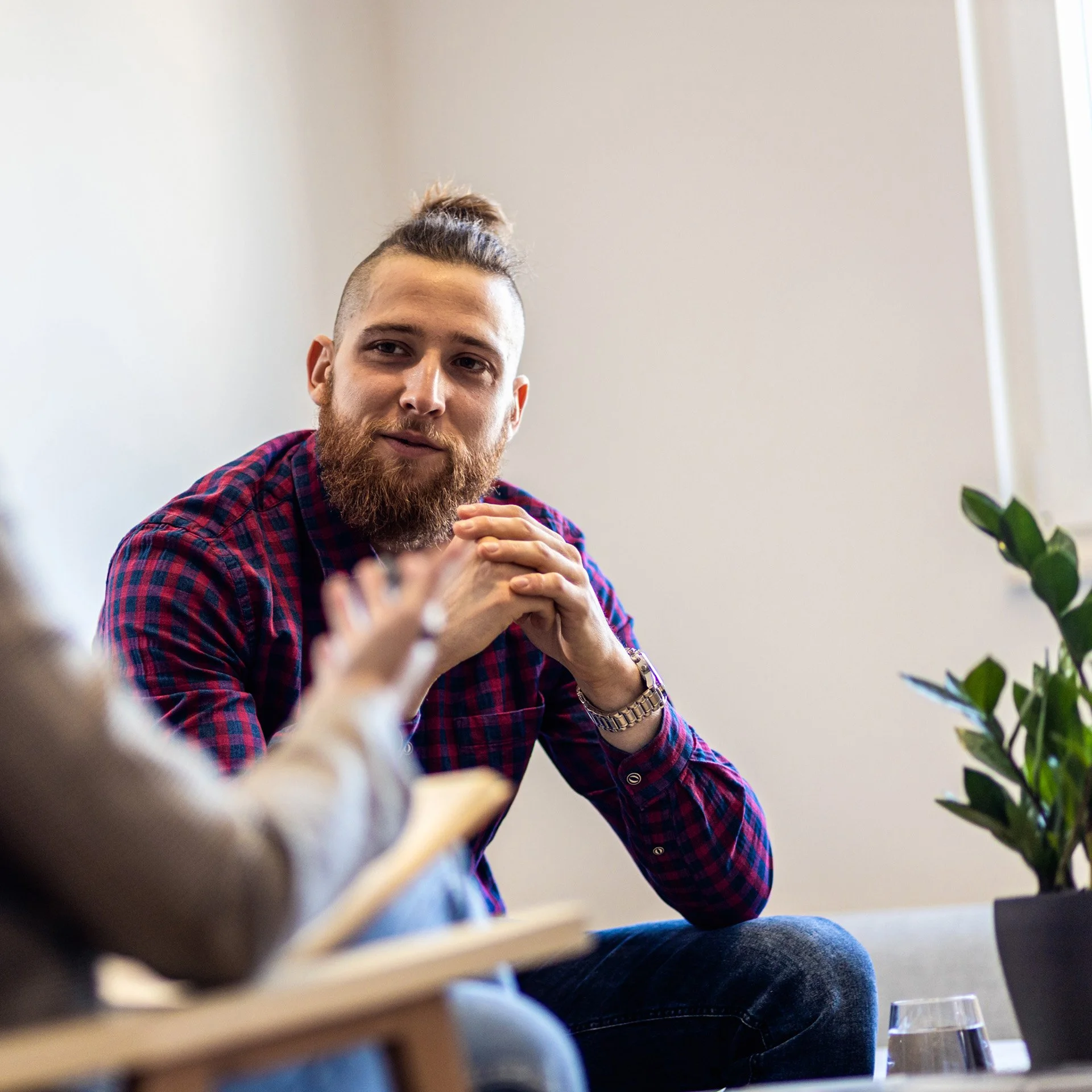 man in flannel in counseling session