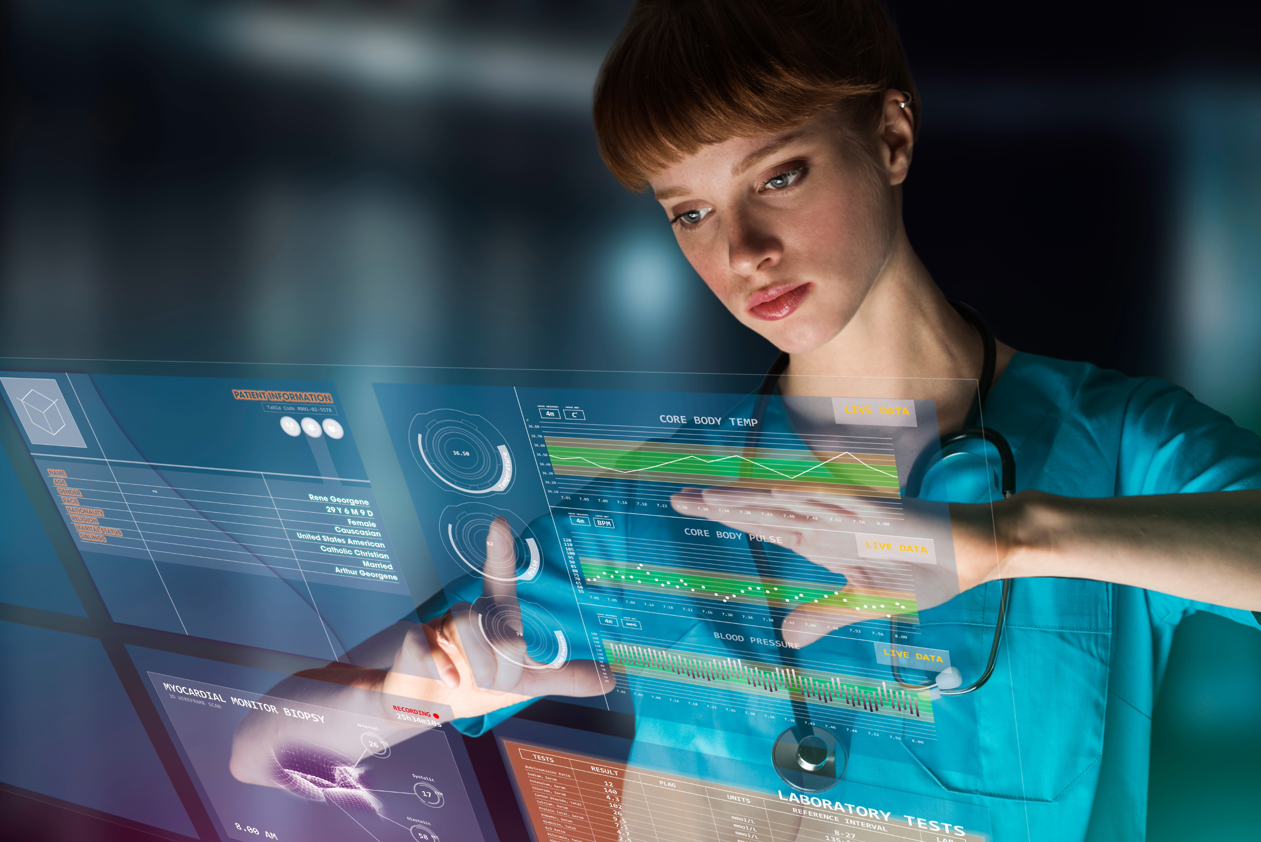 Woman doctor uses technology to loo at patient data