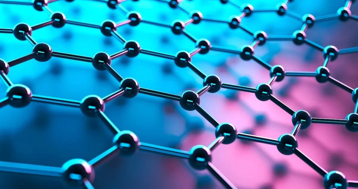 Close-up of molecular structure with interconnected black spheres and rods, illuminated by blue and pink neon lighting.