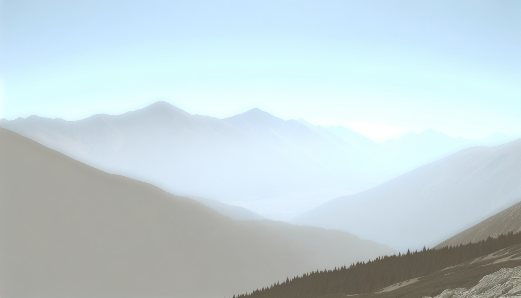 A scenic view of distant mountain ranges under a clear sky with sun glare, showing layered silhouettes of mountain peaks and forested slopes in the foreground.