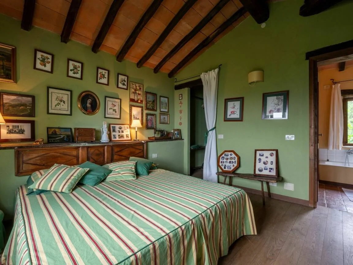A cozy italian bedroom of a holiday home for rent on the italian countryside of Piemonte. Near the village of Roccaverano, Monastero Bormida