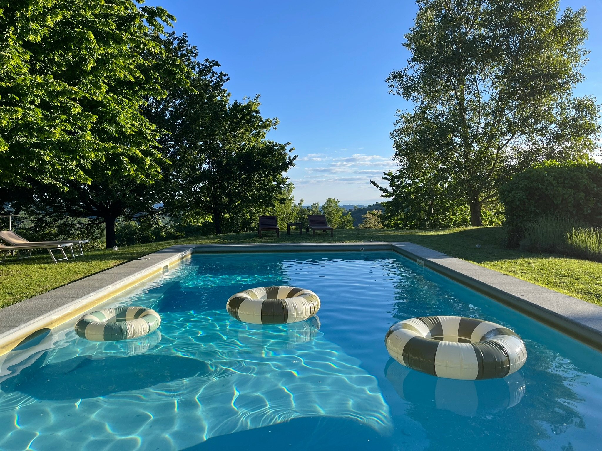 A large swimming pool with panoramic view in Roccaverano, Asti, Italy. Piemonte