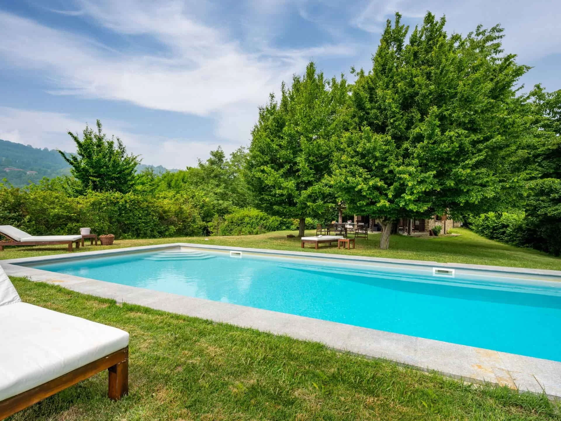 A large swimming pool with panoramic view in Roccaverano, Asti, Italy. Piemonte