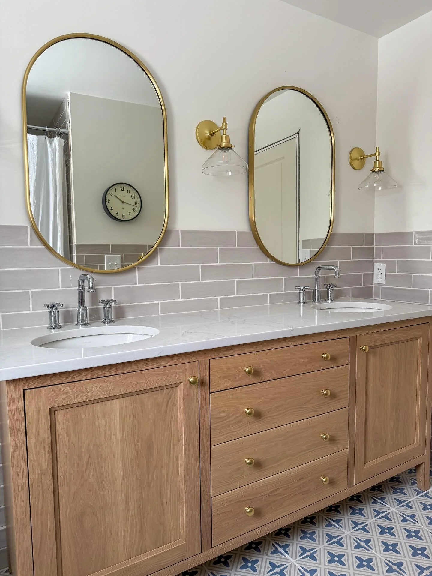 The goal in this secondary bathroom was to create a timeless space that would be fun enough for four kids, yet also able to grow with them. The patterned floor mixed with other neutral elements creates a beautiful balance of fun and calm. We mixed br