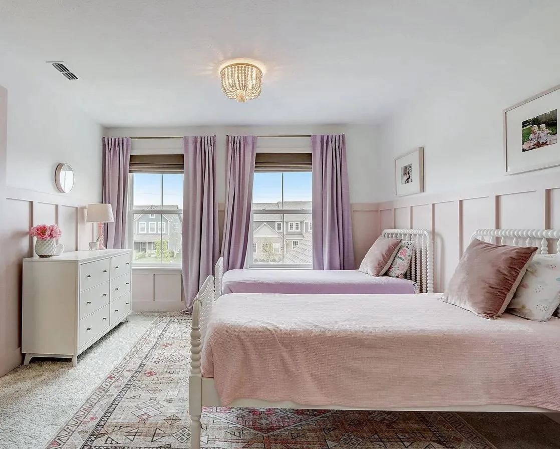 Thinking back to this sweet shared bedroom. The combination of pinks and purples made the room feel fit for a princess while the natural textures in the shades and the rug grounded the space. The beaded chandelier was the perfect fancy finishing touc