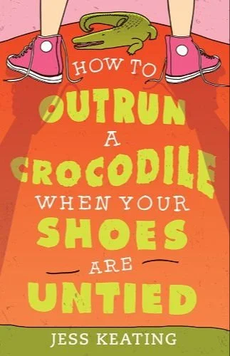 Book cover titled 'How to Outrun a Crocodile When Your Shoes Are Untied' by Jess Keating. The cover features a person standing with pink shoes, one of which has a loose shoelace, and a small crocodile on a red background.