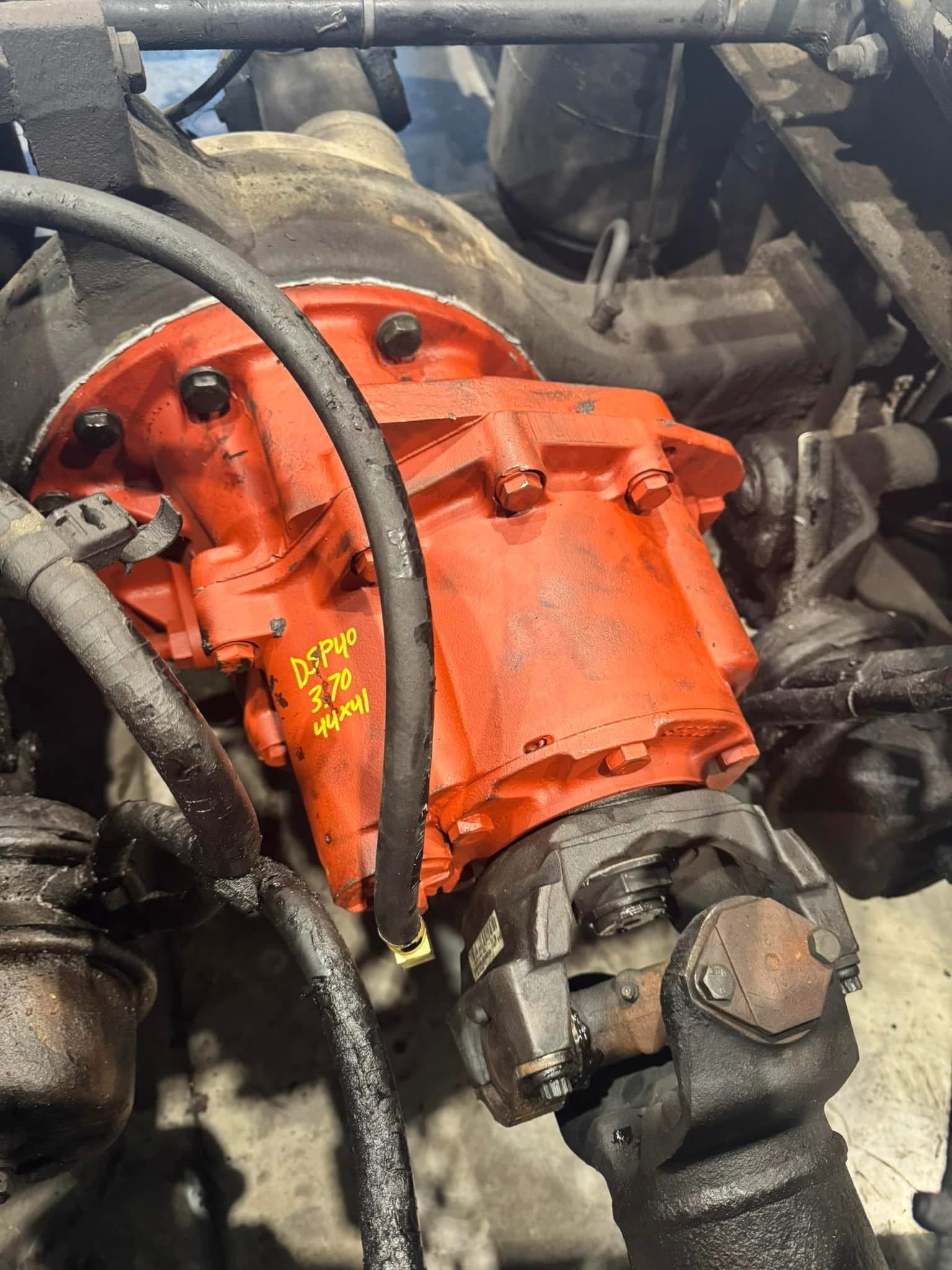 Bright orange heavy-duty differential freshly installed in a PRS Truck Repair diesel truck at the Burgettstown, PA shop