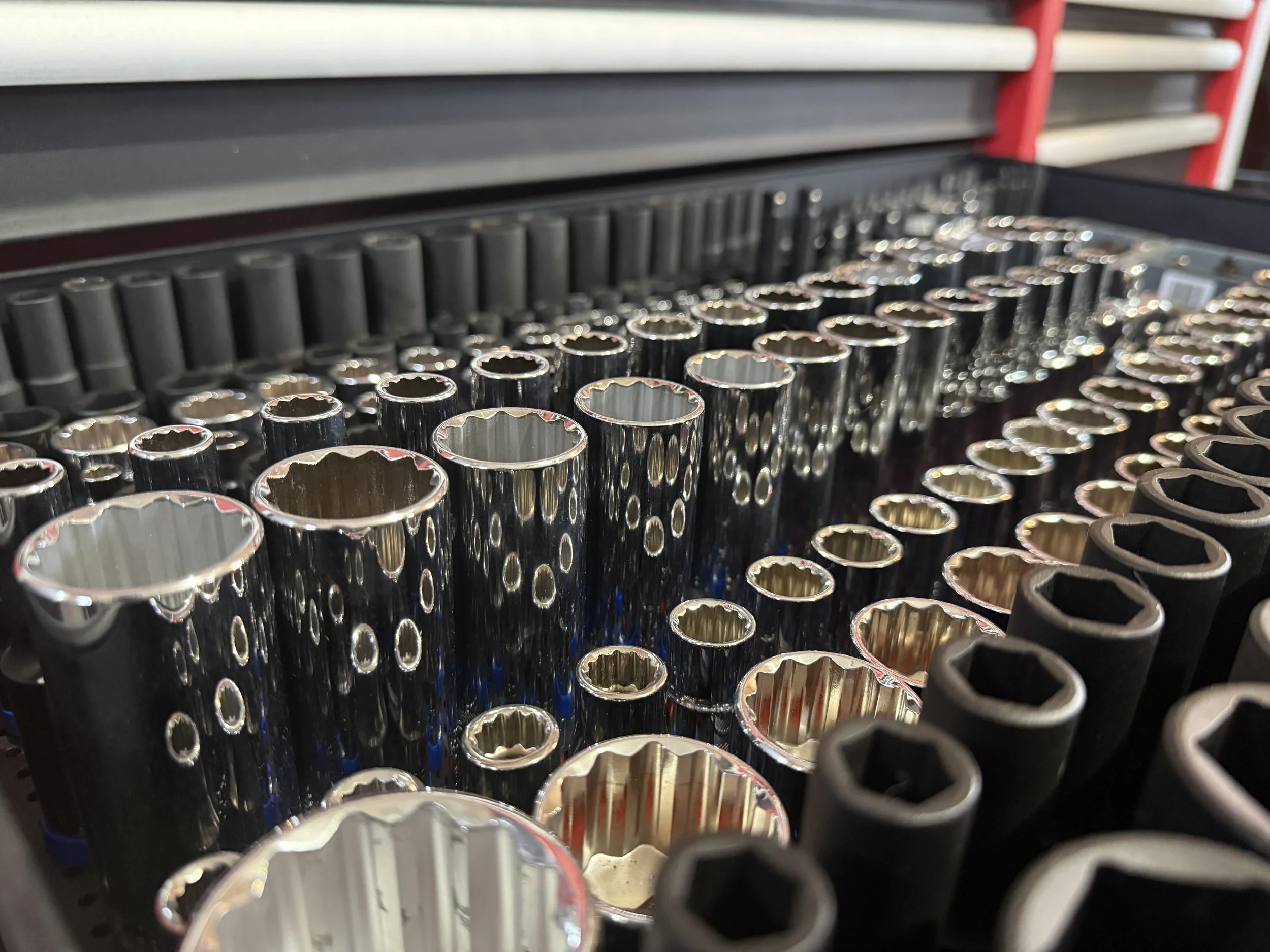 Clean organized garage with tools and storage shelves.