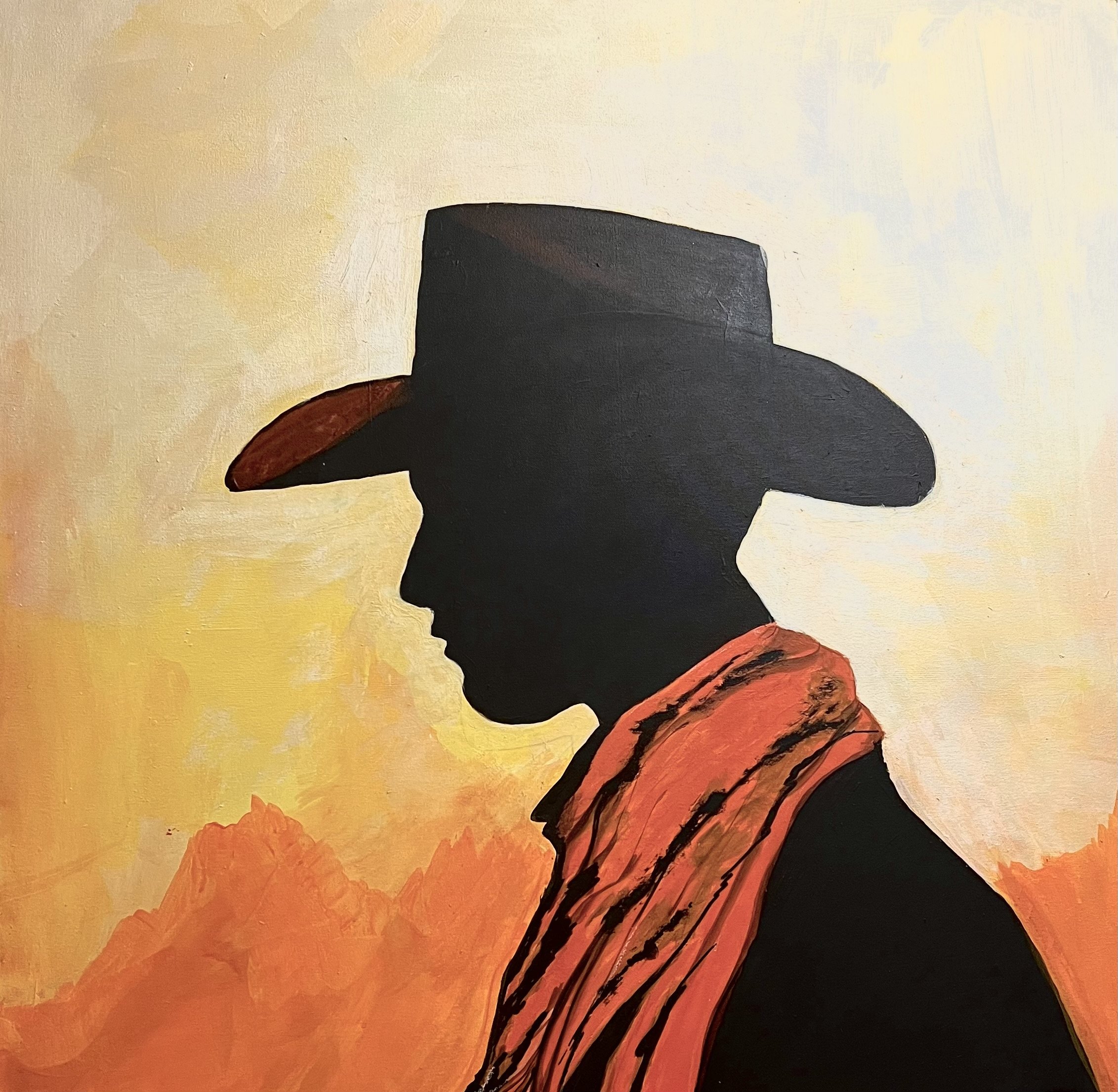 Silhouette of a person wearing a cowboy hat and bandana against a desert mountain background.