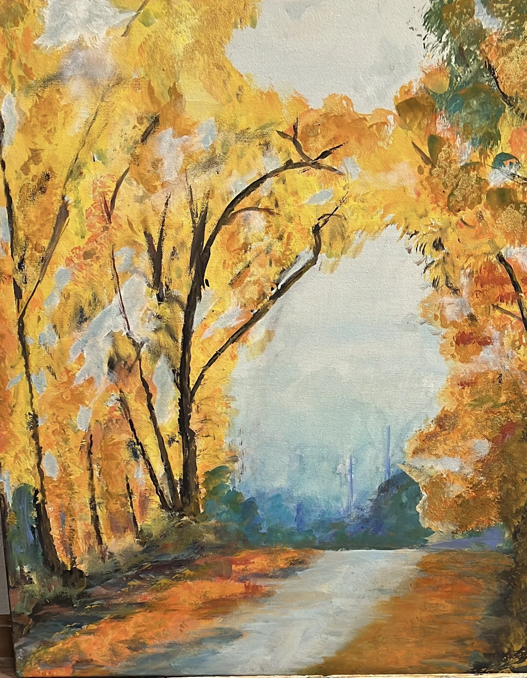A landscape painting of an autumn scene with yellow and orange trees along a winding path, with a hazy sky in the background.
