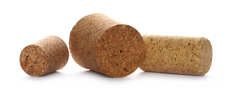 Three wine corks of varying sizes placed horizontally on a white background.