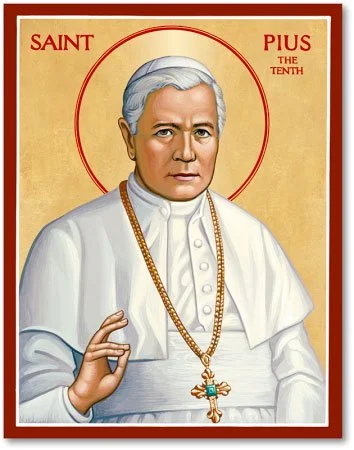 Illustration of Saint Pius X. He is depicted with white hair, wearing a white clerical robe and a gold chain with a cross. He has a halo around his head and is making a gesture with his right hand. The background is gold with a red border, and the text reads 'Saint Pius the Tenth'.