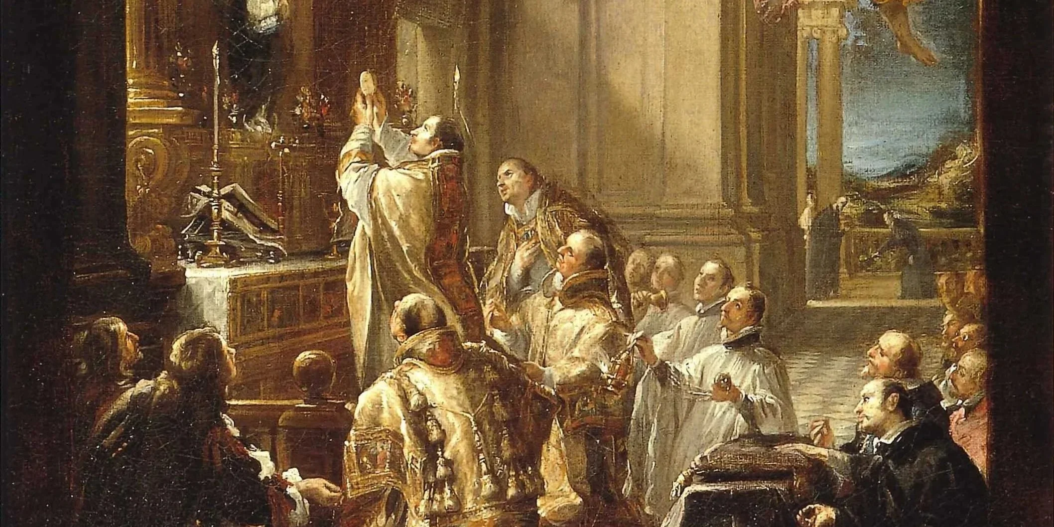 Scenic view of a lake surrounded by green hills and mountains under a cloudy sky.