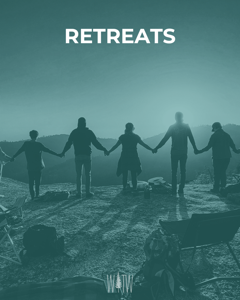 Group of people holding hands and standing on a hilltop during sunset or sunrise, with camping gear and backpacks in the foreground. The word 'RETREATS' is displayed at the top.