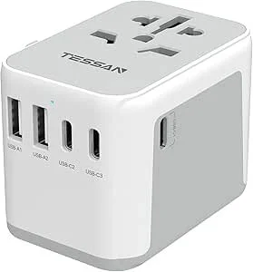 White multi-port power outlet with four USB ports and a universal electrical socket.
