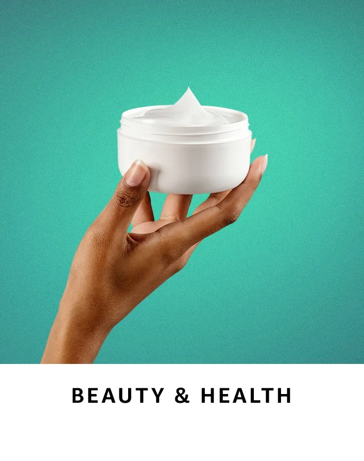 A hand holding a white container of cream or moisturizer against a teal background, with text "BEAUTY & HEALTH" beneath the image.
